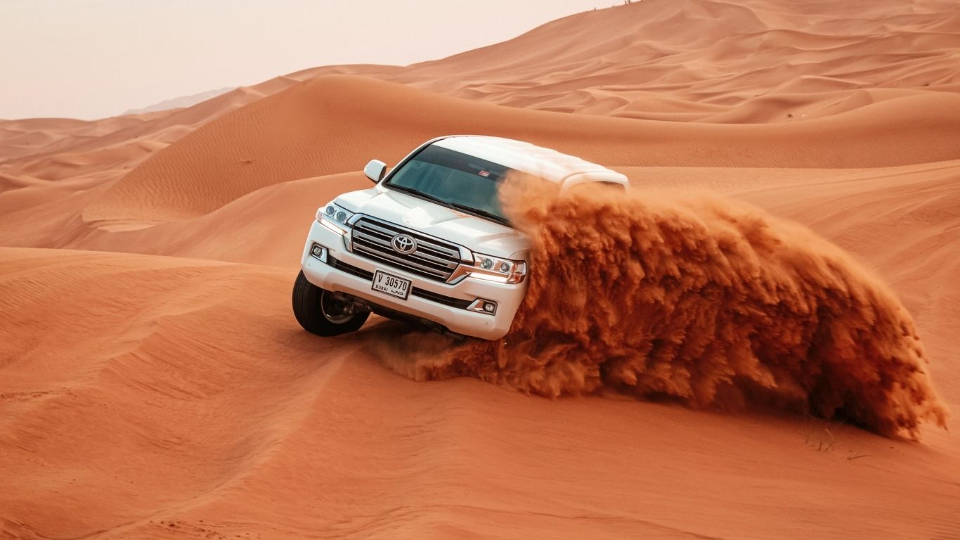 Check out this epic shot of a Land Cruiser tackling UAE dunes.jpg