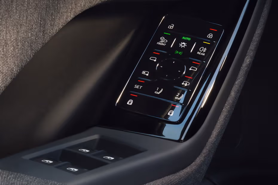 Audi Q6 Sportback e-tron 2026 power window switches and side mirror adjustment controls on driver door