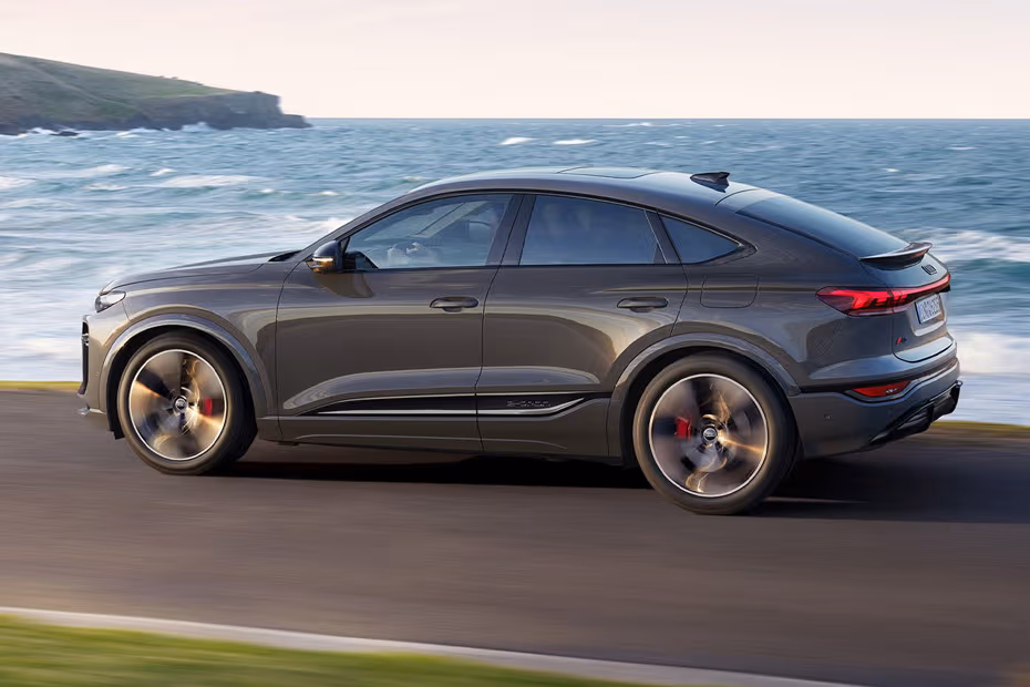 Audi Q6 Sportback e-tron 2026 Rear Left side angle view showing taillights, tailgate and alloy wheels