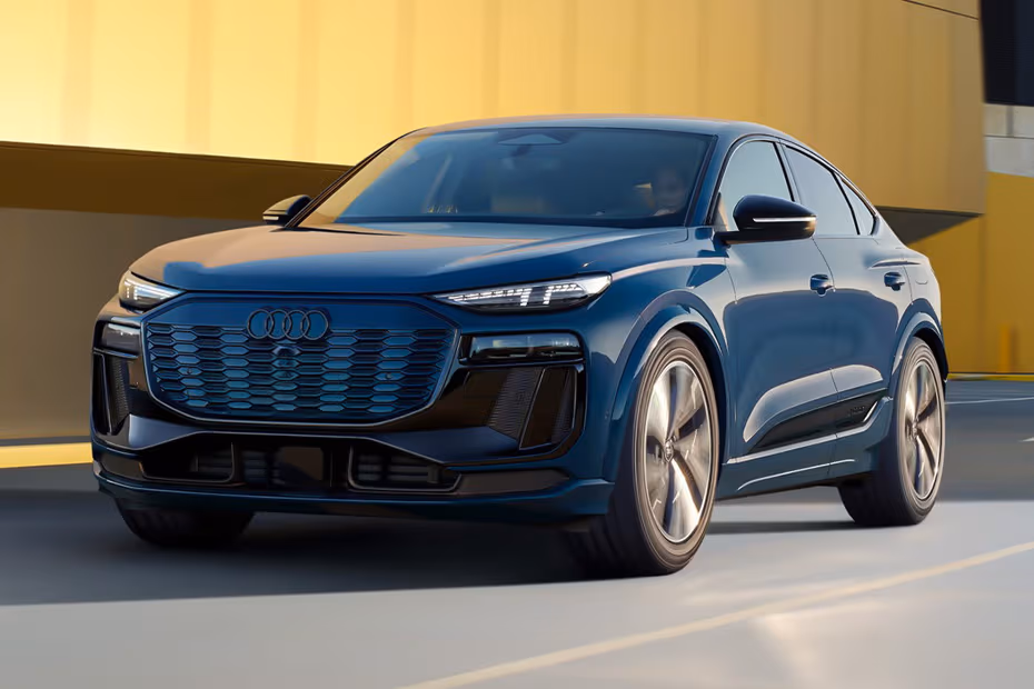 Audi SQ6 Sportback e-tron 2026 front left side angle view on city street