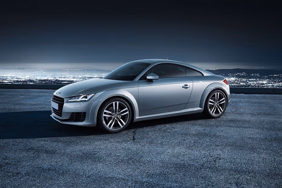 Audi TT Coupe 2026 front left side angle view on city street