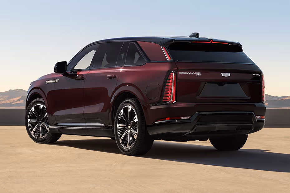 Cadillac Escalade IQ 2026 SUV Rear left side angle view showing taillights, tailgate and alloy wheels
