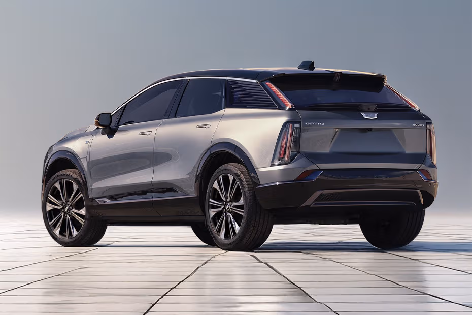 Cadillac Optiq 2025 Rear left side angle view showing taillights, tailgate and alloy wheels