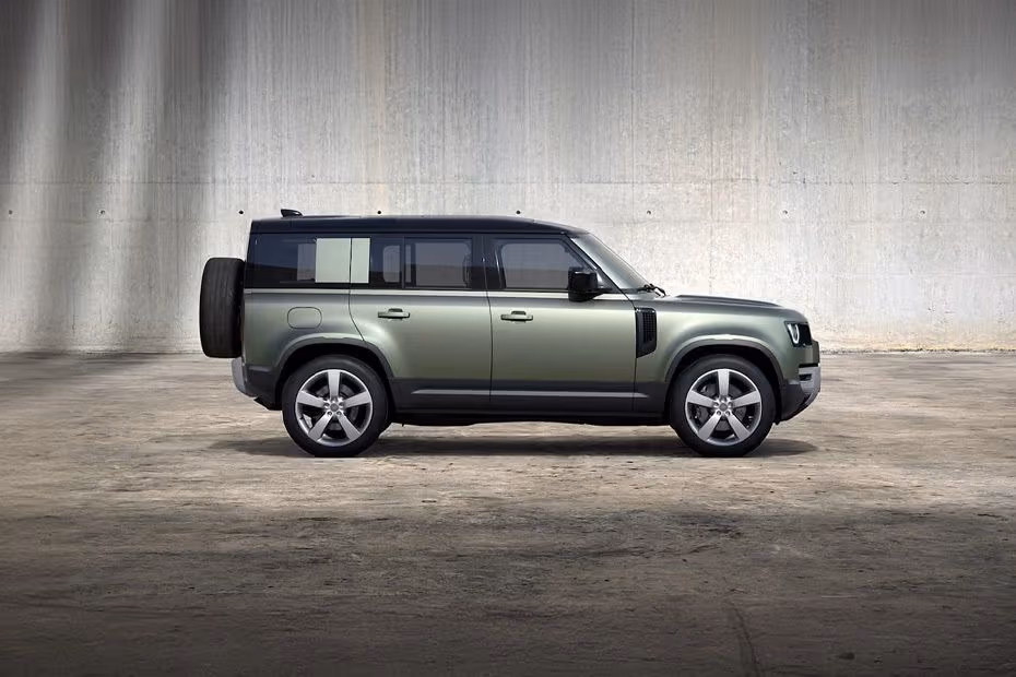 Land Rover DEFENDER 110 2026 Front right side angle view on city street