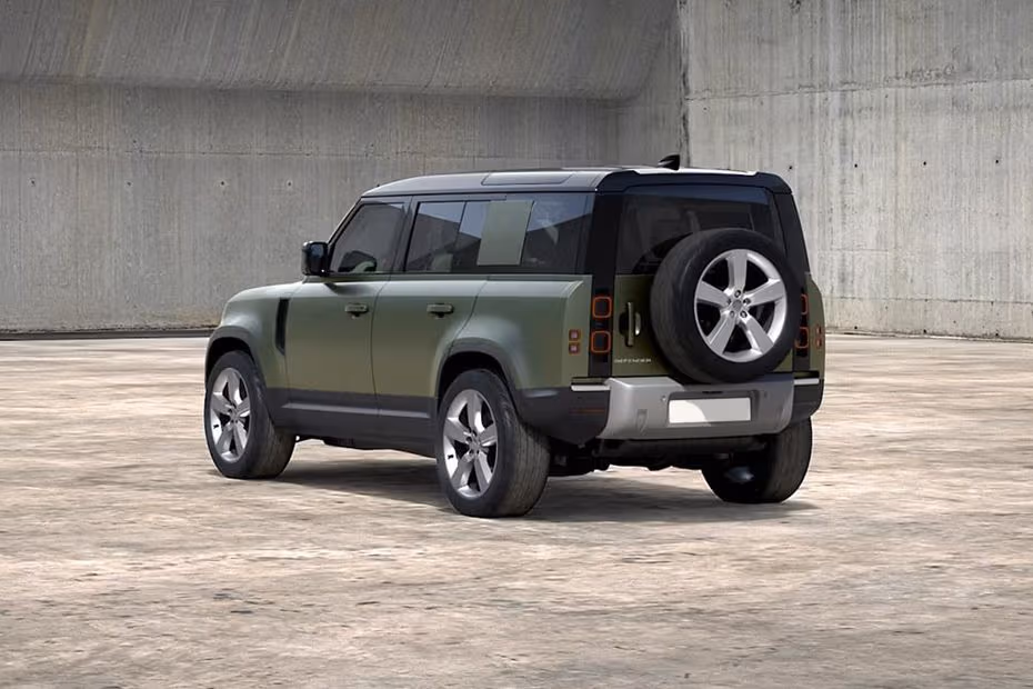 Land Rover DEFENDER 110 2026 Rear left side angle view showing taillights, tailgate and alloy wheels
