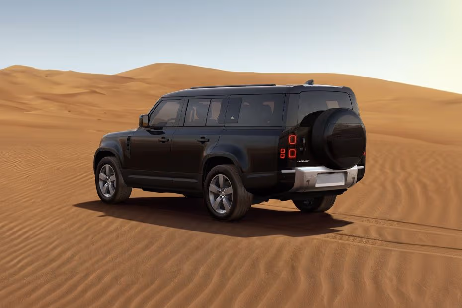 Land Rover DEFENDER 130 2026 Rear left side angle view showing taillights, tailgate and alloy wheels