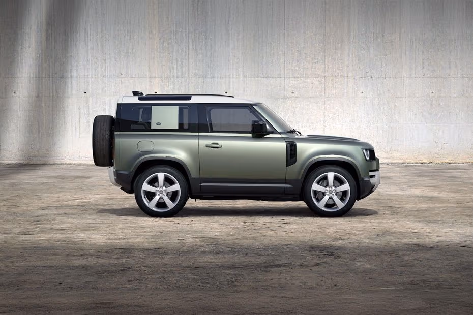 Land Rover DEFENDER 90 2026 Front Right Side Angle View on City Street
