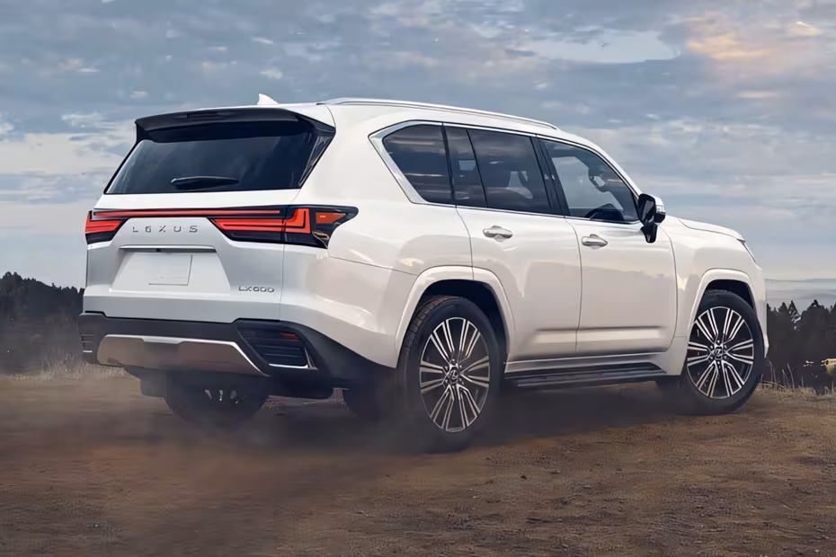 Lexus LX SUV 2026 Sonic Quartz rear three-quarter angle view showing taillights and alloy wheels